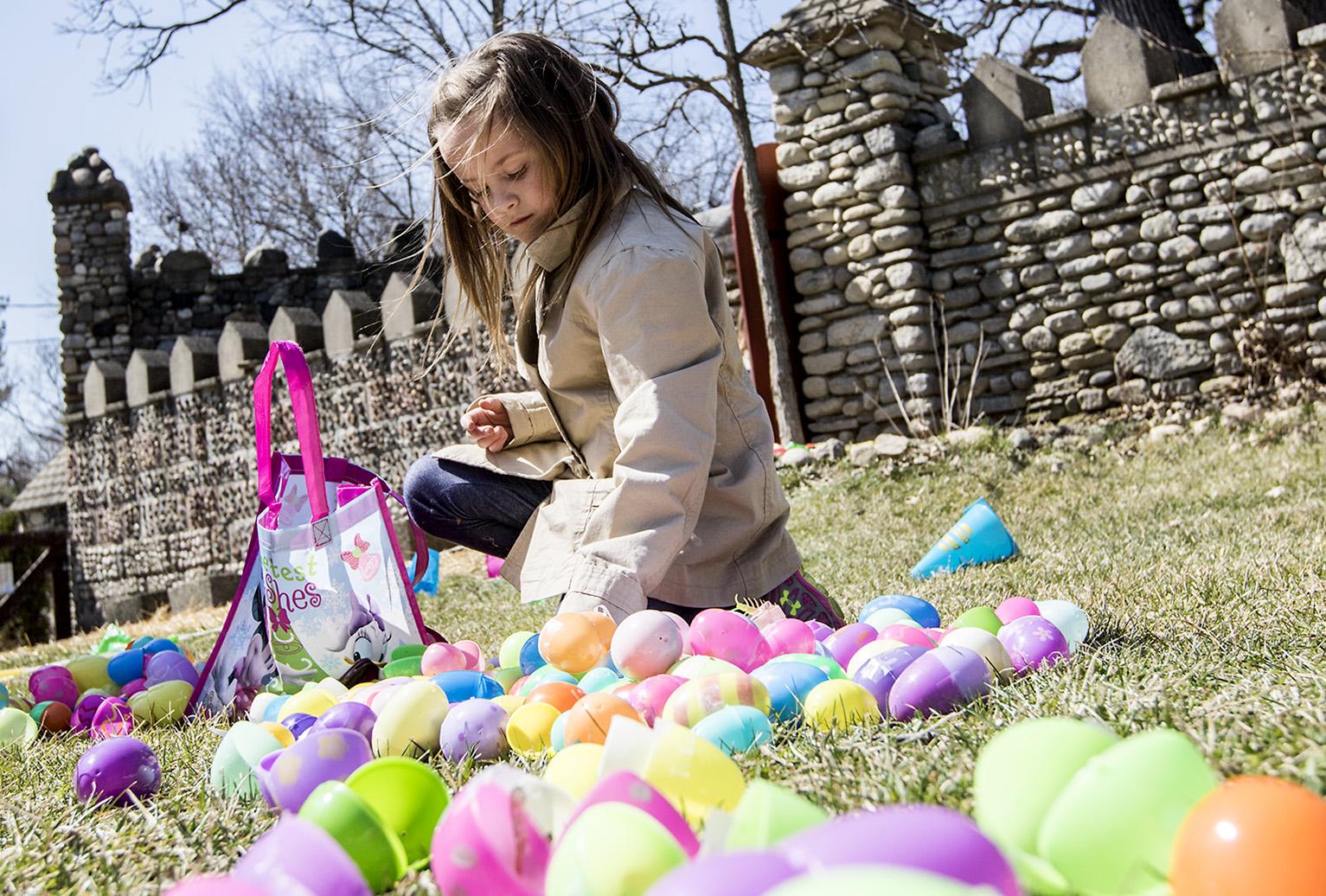 Girl at castle with easter eggs