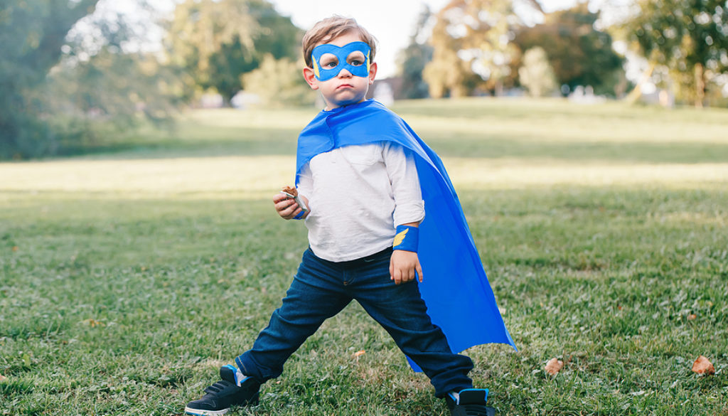 Cute Adorable Preschool Caucasian Child Playing Superhero In Blu